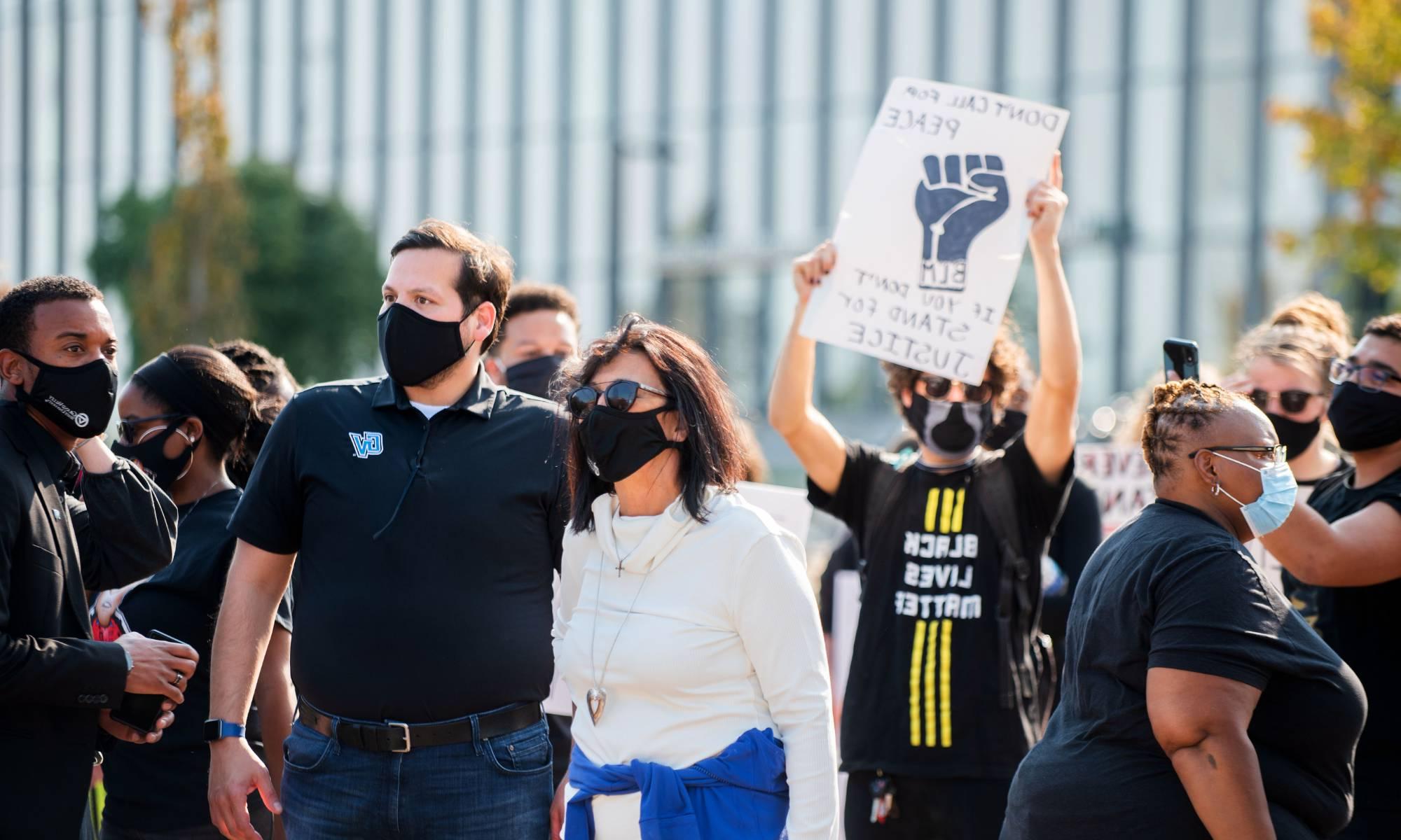 Philomena Mantella and Jesse Bernal attending a Black Lives Matter protest. Multiple protesting students are in the background.